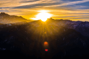 Sunrise over a mountain range, symbolizing hope and a new chapter for Texas parole reform.